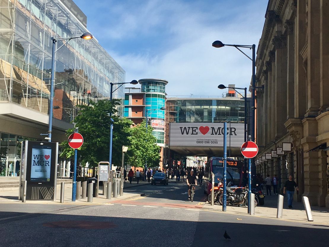 By Tuesday afternoon, many had returned to Manchester's shopping district while billboards shared messages of defiance.