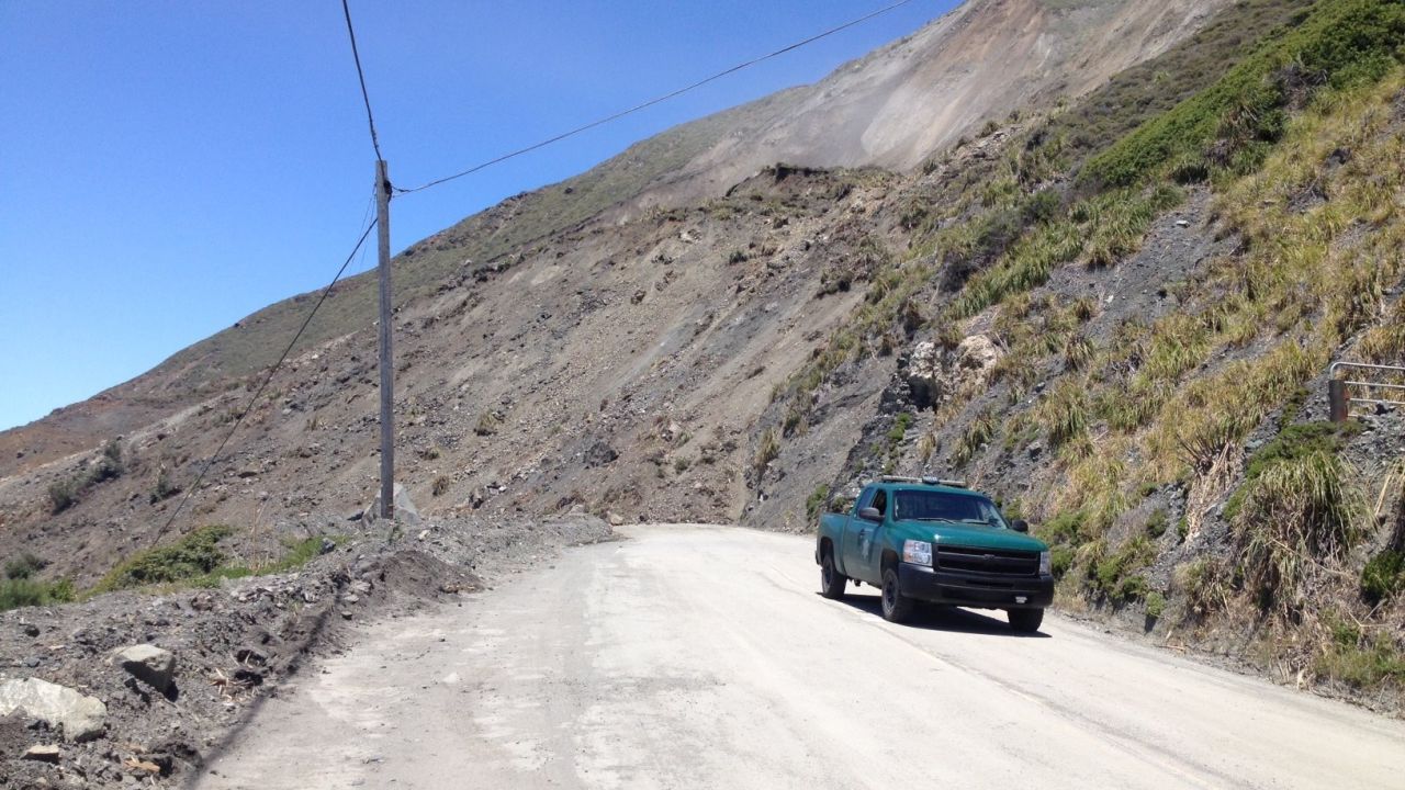 Saturday's Mud Creek slide left a pile of earth about 35 to 40 feet high covering the highway.