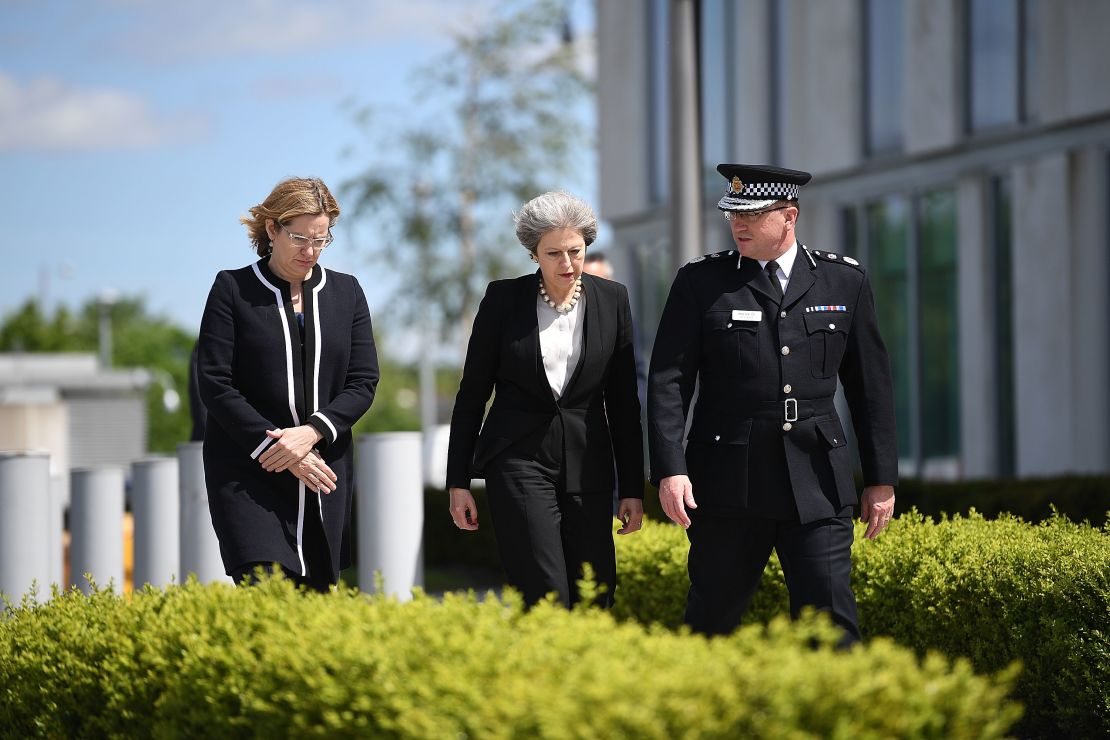 Home Secretary Amber Rudd, left, and Britain's Prime Minister Theresa May meet Chief Constable of Greater Manchester Police Ian Hopkins.