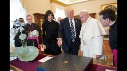 Pope Francis exchanges gifts with President Trump and Melania Trump during an audience at the Apostolic Palace in Vatican City.