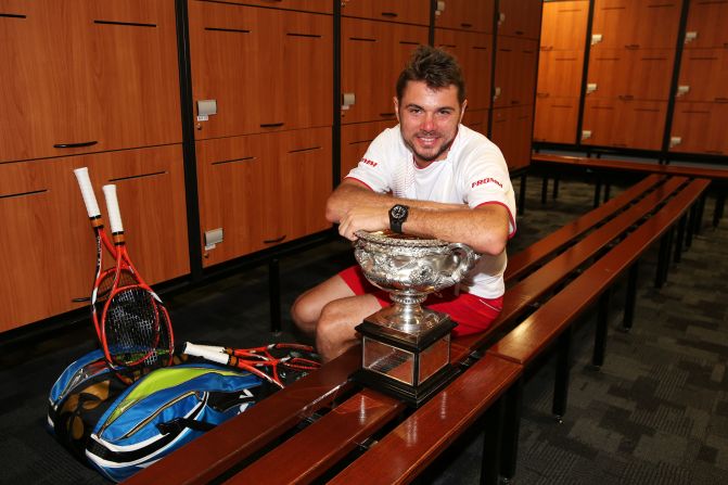 Stanislas Wawrinka of Switzerland is pictured posing with the Norman Brookes Challenge Cup in the players' dressing room after winning his men's final match against Nadal of Spain at the 2014 Australian Open at Melbourne Park.