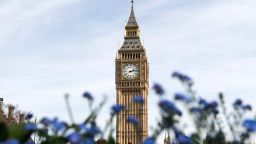 Elizabeth Tower (Big Ben) at the Houses of Parliament is pictured behind flowers in London on March 30, 2017.
Britain launched the historic process of leaving the EU on Wednesday, saying there was "no turning back", but its European partners were quick to warn of the difficult path ahead. / AFP PHOTO / Justin TALLIS        (Photo credit should read JUSTIN TALLIS/AFP/Getty Images)