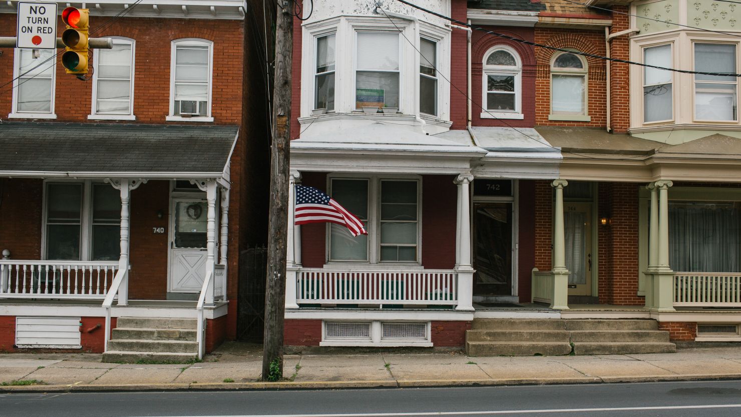 An American flag blows in the wind at the intersection of College and West Orange Street in Lancaster, Pennsylvania.