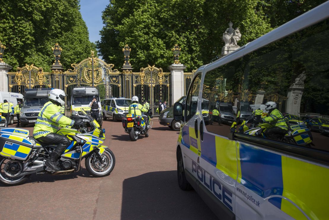 Police safeguard Buckingham Palace in London on Wednesday.