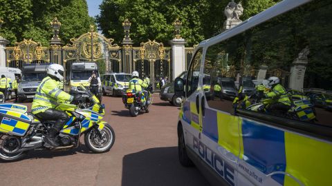 Police safeguard Buckingham Palace in London on Wednesday.