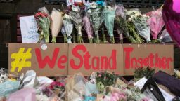 Floral tributes and a message that reads "We Stand Together" are pictured in Albert Square in Manchester, northwest England on May 24, 2017, left as tributes to the victims of the May 22 terror attack at the Manchester Arena.
Police on Tuesday named Salman Abedi -- reportedly British-born of Libyan descent -- as the suspect behind a suicide bombing that ripped into young fans at an Ariana Grande concert at the Manchester Arena on May 22, as the Islamic State group claimed responsibility for the carnage. / AFP PHOTO / CHRIS J RATCLIFFE        (Photo credit should read CHRIS J RATCLIFFE/AFP/Getty Images)