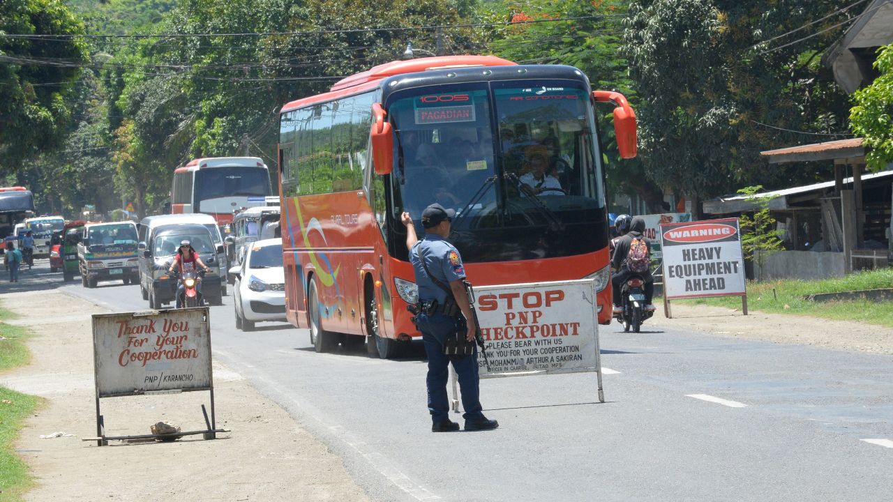 A police officer mans a checkpoint on a highway in Iligan City on the southern island of Mindanao on May 24.
