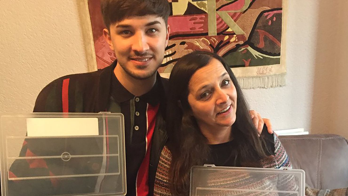 Martyn Hett and his mother pose for a photo after a "busy weekend knitting."