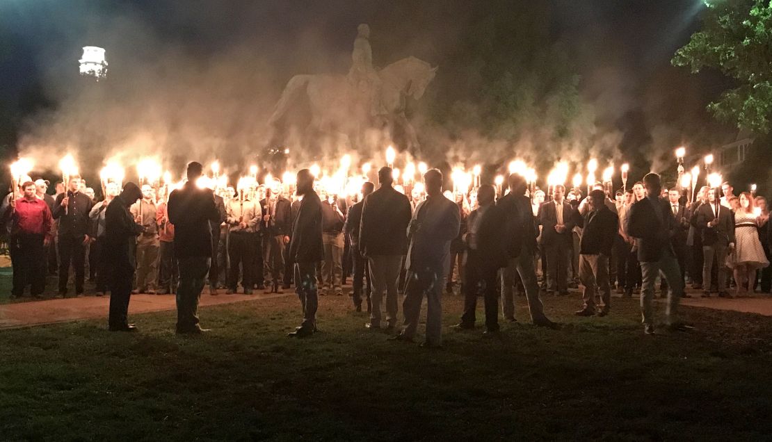 A group of torch-wielding protesters gathered in a Charlottesville park recently to protest the planned removal of a statue Gen. Robert E. Lee.