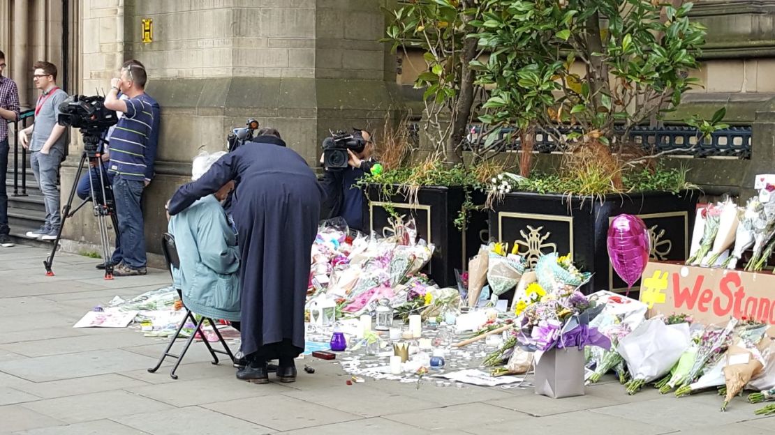 Patel comforted Black as she began to cry at the temporary memorial.