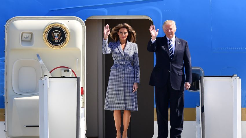 TOPSHOT - US President Donald Trump (R) and First Lady Melania Trump wave as they step off Air Force One upon their arrival at Melsbroek military airport in Steenokkerzeel on May 24, 2017, on the eve of the NATO summit.
Hoping for the best, fearing the worst: EU and NATO leaders are braced for their first meeting with US President Donald Trump on their home turf on May 25, 2017. / AFP PHOTO / Emmanuel DUNAND (Photo credit should read EMMANUEL DUNAND/AFP/Getty Images)