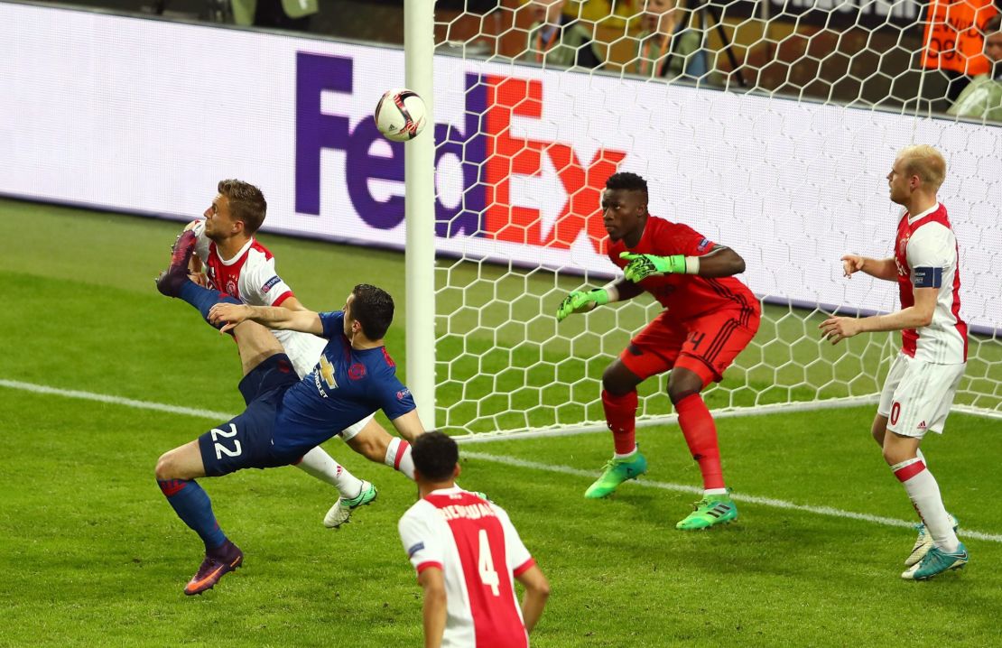 Henrikh Mkhitaryan scores Manchester United's second goal of the evening 