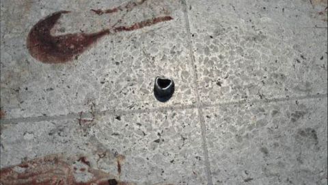 Another piece of shrapnel that appears to be a bolt, seen on the floor near the area of the attack that killed 22 people.