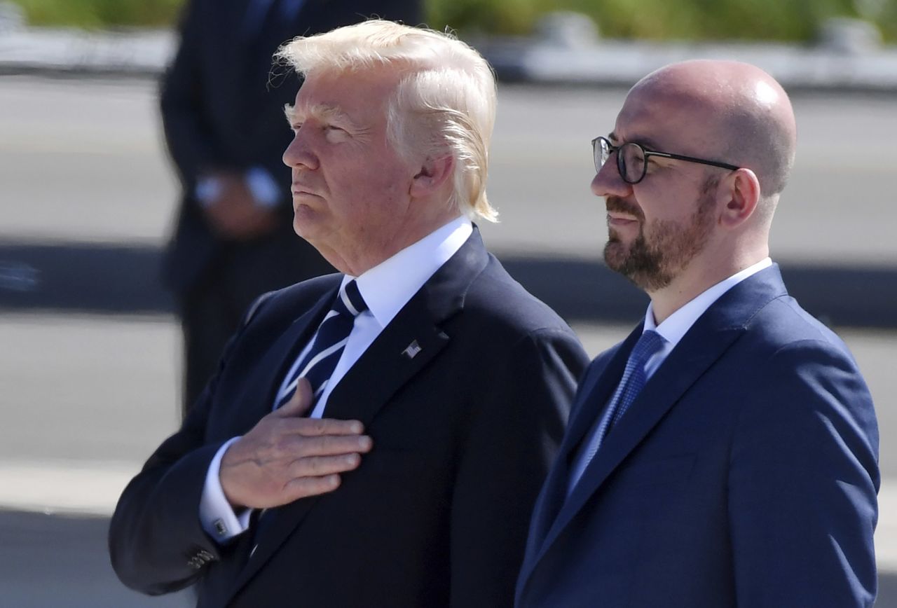 Trump stands with Belgian Prime Minister Charles Michel while the national anthem is played during Trump's arrival in Belgium on May 24.