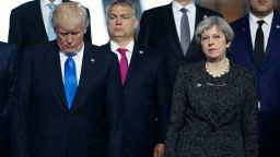 President Donald Trump stands with British Prime Minister Theresa May during a group photo with NATO leaders at the new NATO headquarters, Thursday, May 25, 2017, in Brussels. (AP Photo/Evan Vucci)