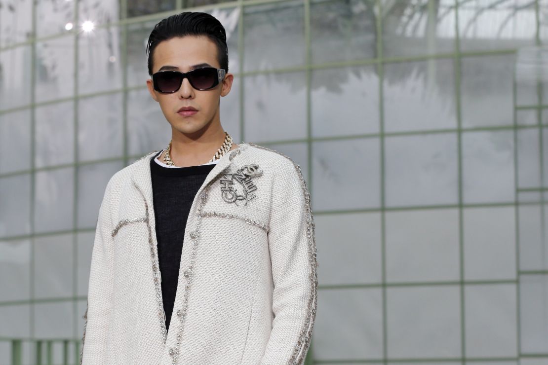 G-Dragon, poses at the Chanel 2015 Haute Couture Spring-Summer collection.