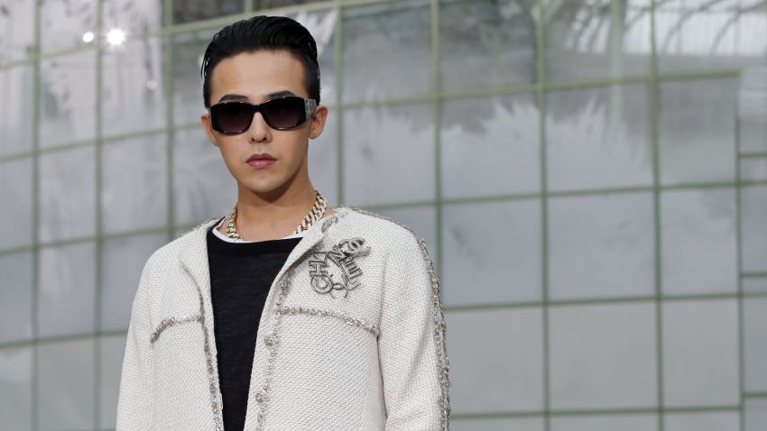South Korean singer Kwon Ji Yong, aka G-Dragon, poses prior to attend Chanel 2015 Haute Couture Spring-Summer collection fashion show on January 27, 2015 at the Grand Palais in Paris.  AFP PHOTO / FRANCOIS GUILLOT        (Photo credit should read FRANCOIS GUILLOT/AFP/Getty Images)