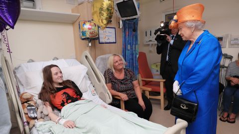 Queen Elizabeth II speaks to Millie Robson, 15, and her mother, Marie, during a hospital visit to meet victims of the terror attack in Manchester. 
