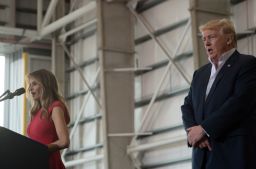 US President Donald Trump listens as his wife, First Lady Melania Trump recites the Lord's Prayer during a rally in Melbourne, Florida on February 18, 2017.   