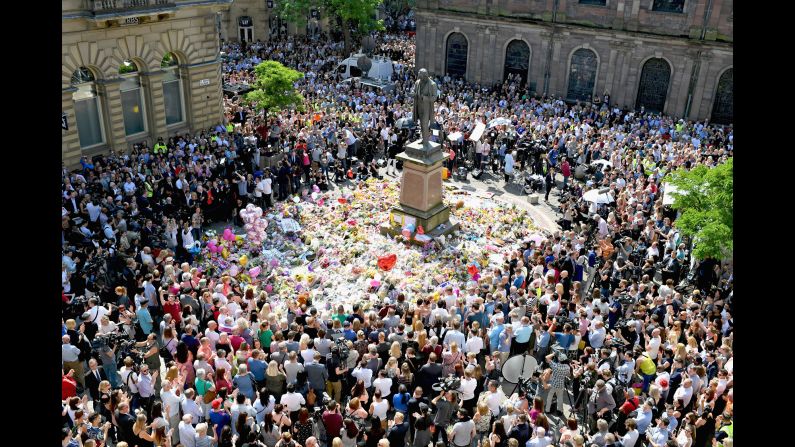 People in Manchester, England, gather in St. Ann's Square on Thursday, May 25. They were observing a national minute of silence to remember <a href="index.php?page=&url=http%3A%2F%2Fedition.cnn.com%2F2017%2F05%2F23%2Feurope%2Fmanchester-attack-victims%2Findex.html" target="_blank">the victims </a>of a suicide bombing at an Ariana Grande concert.