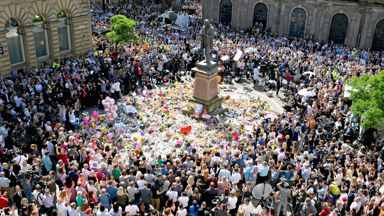 People in Manchester, England, gather in St. Ann's Square on Thursday, May 25. They were observing a national minute of silence to remember the victims of <a href="http://www.cnn.com/2017/05/22/europe/gallery/manchester-arena-incident/index.html" target="_blank">a suicide bombing</a> at an Ariana Grande concert. <a href="http://www.cnn.com/2017/05/23/europe/manchester-attack-victims/index.html" target="_blank">Who were the victims? Read their stories</a>