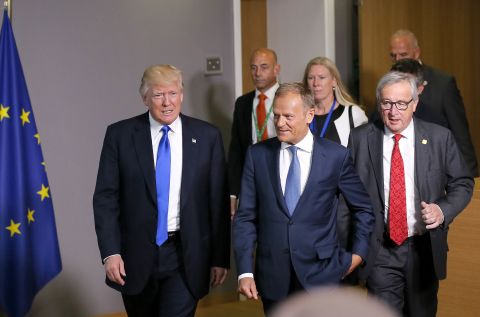 Trump walks with European Council President Donald Tusk, center, and European Commission President Jean-Claude Juncker, right, after they met at the European Council in Brussels on May 25.