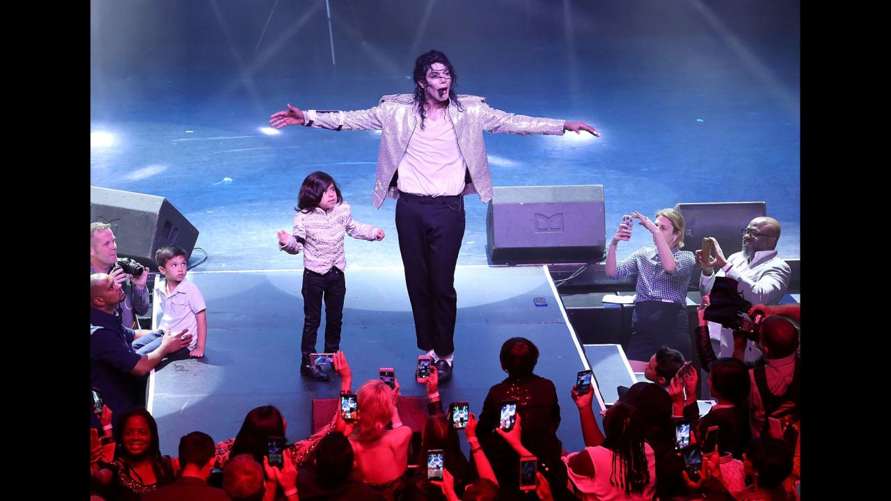Navi, a Michael Jackson impersonator, performs in Hollywood during the premiere of "Michael Jackson: Searching for Neverland" on Tuesday, May 23.
