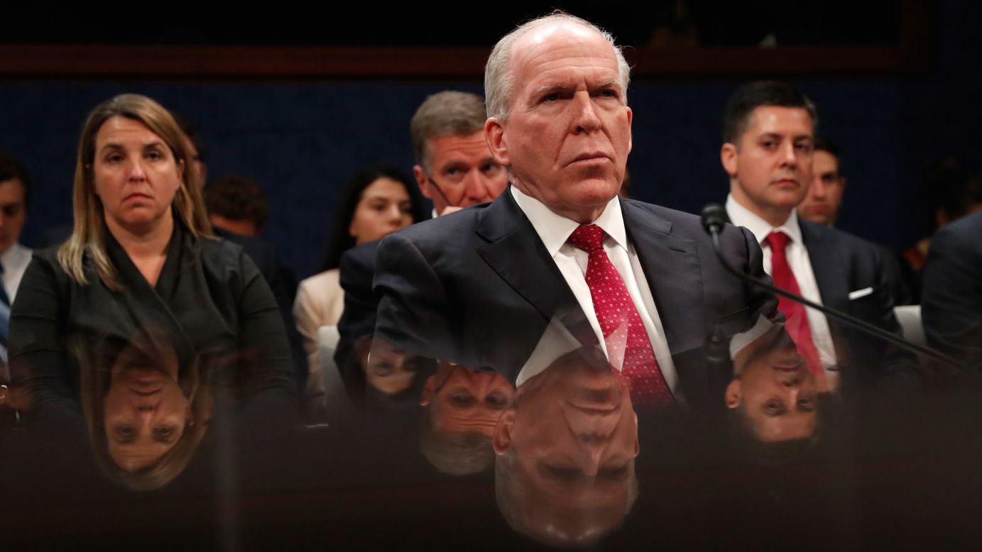 Former CIA Director John Brennan is reflected by a table as he prepares to testify in Washington on Tuesday, May 23. <a href="http://www.cnn.com/2017/05/23/politics/john-brennan-house-intelligence-committee/" target="_blank">He told House investigators</a> that Russia "brazenly interfered" in US elections, including actively contacting members of Donald Trump's campaign. But he stopped shy of dubbing it "collusion."