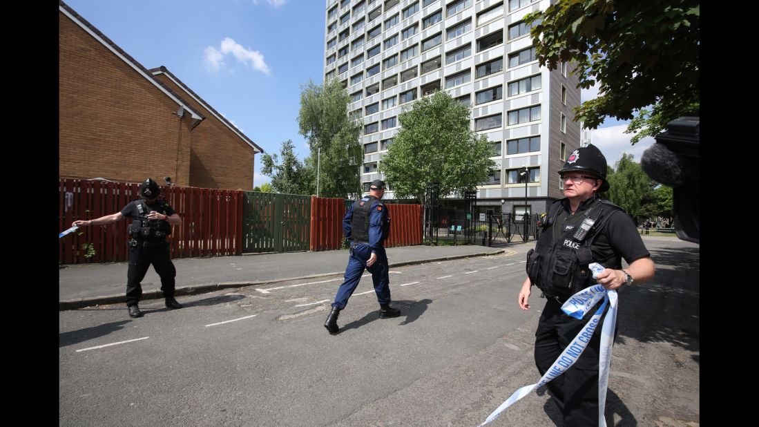 A Manchester road is closed off as police raids continued on May 25.