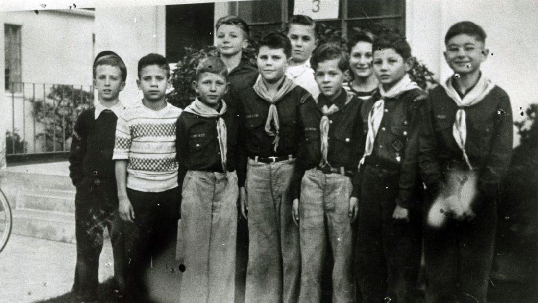 Kennedy, third from right in the front row, stands with other Cub Scouts in the 1940s.