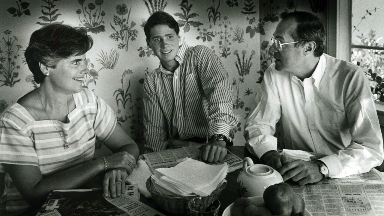 Kennedy has breakfast with his wife, Mary, and his son Gregory in 1984.