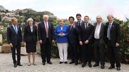 TAORMINA, ITALY - MAY 26:  G7 leaders European Council President Donald Tusk, British Prime Minister Theresa May, U.S. President Donald Trump, German Chancellor Angela Merkel, Japanese Prime Minister Shinzo Abe, Canadian Prime Minister Justin Trudeau, French President Emmanuel Macron, European Commission President Jean-Claude Juncker and Italian Prime Minister Paolo Gentiloni pose for a family photo as they attend a flypast at San Domenico Palace Hotel on May 26, 2017 in Taormina , Italy. US President Donald Trump and British Prime Minister Theresa May attend a G7 summit for the first time since their elections.  Also new to the table is French President Emmanuel Macron. China have been invited to a meeting during the summit for the first time.  (Photo by Dan Kitwood/Getty Images)