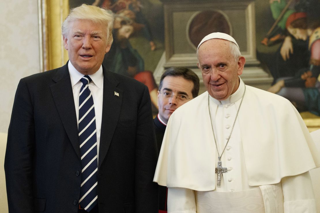 Pope Francis stands with US President Donald Trump during a private audience at the Vatican on May 24, 2017.
