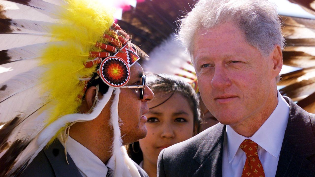 President Bill Clinton listens to Oglala Sioux Nation President Harold Salway on July 7, 1999, at Pine Ridge Indian Reservation.