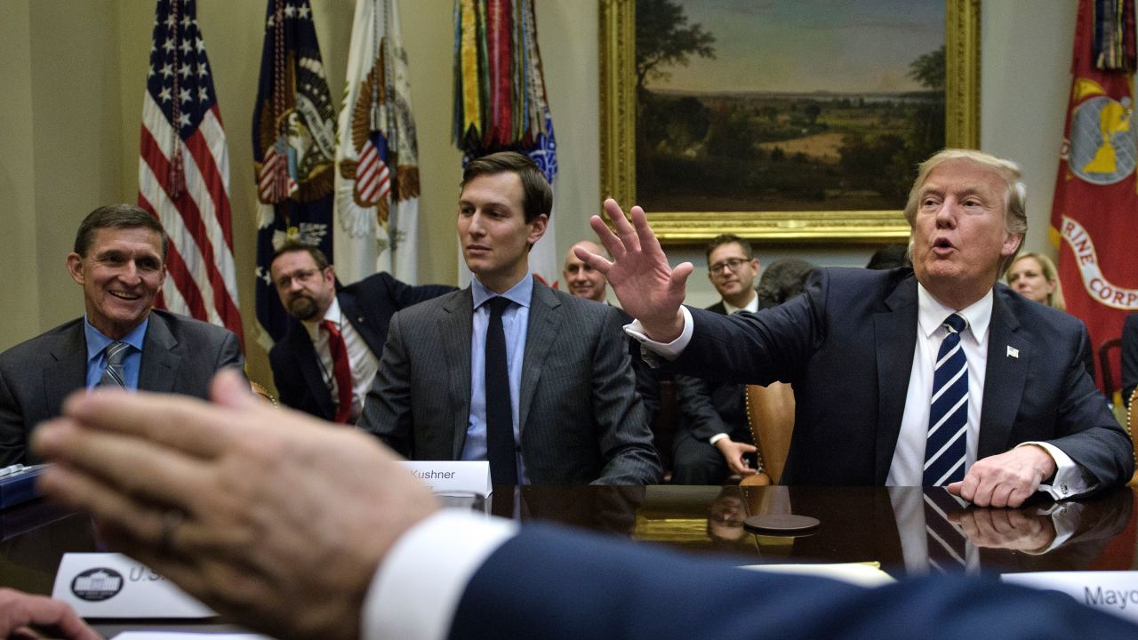 National Security Advisor General Mike Flynn (L), Senior Advisor Jared Kushner (2L), US Secretary of Homeland Security US Secretary of Homeland Security John Kelly (R) and others listen while US President Donald Trump speaks at the beginning of a meeting on cyber security in the Roosevelt Room of the White House January 31, 2017 in Washington, DC. / AFP / Brendan Smialowski        (Photo credit should read BRENDAN SMIALOWSKI/AFP/Getty Images)