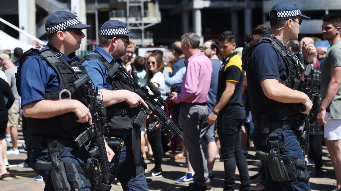 Armed police officers patrol outside a rugby final at Twickenham in London on Saturday.