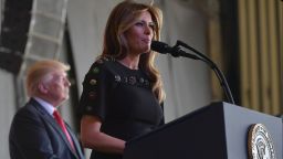 US first lady Melania Trump address US military personnel and families at Naval Air Station Sigonella as US President Donald Trump stands on stage, after G7 summit of Heads of State and Government, on May 27, near Taormina in Sicily.