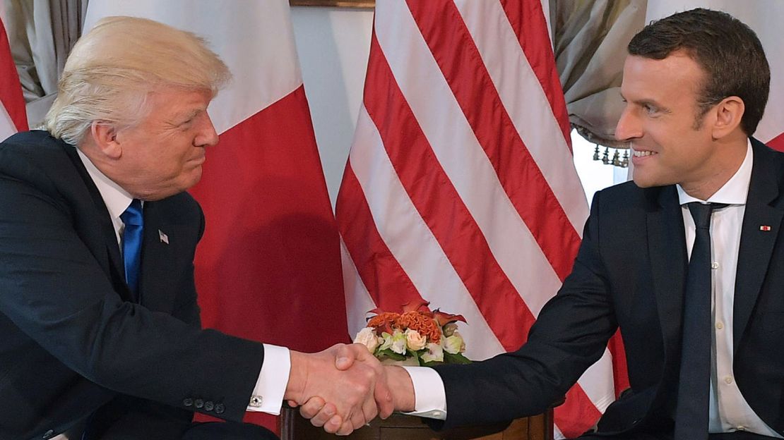 Donald Trump and  Emmanuel Macron shake hands ahead of a working lunch on the sidelines of the NATO summit in Brussels, on May 25, 2017.