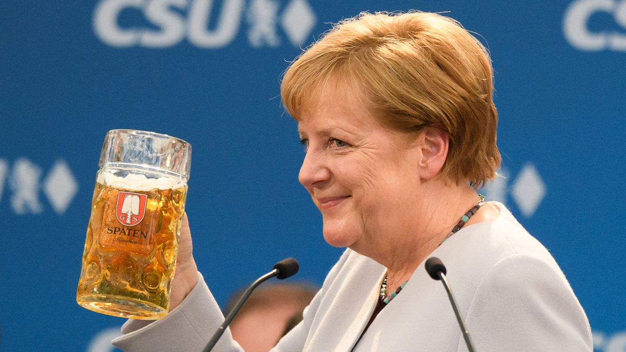 German Chancellor and Chairwoman of the German Christian Democrats (CDU) Angela Merkel holds a beer mug after her speech at the Trudering fest on May 28, 2017 in Munich, Germany. 