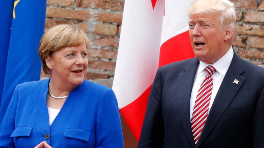 German Chancellor Angela Merkel and US President Donald Trump pose for a family picture as they attend the Summit of the Heads of State and of Government of the G7, the group of most industrialized economies, plus the European Union, on May 26, 2017 at the ancient Greek Theater in Taormina, Sicily.
The leaders of Britain, Canada, France, Germany, Japan, the US and Italy will be joined by representatives of the European Union and the International Monetary Fund (IMF) as well as teams from Ethiopia, Kenya, Niger, Nigeria and Tunisia during the summit from May 26 to 27, 2017. / AFP PHOTO / POOL / PHILIPPE WOJAZER / ALTERNATIVE CROP         (Photo credit should read PHILIPPE WOJAZER/AFP/Getty Images)