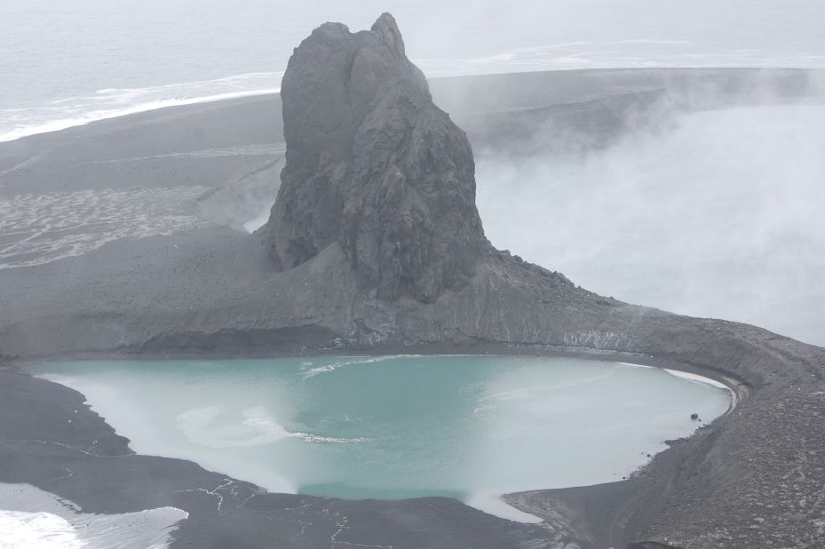 This May 8 file photo of the Bogoslof volcano in Alaska's Aleutian islands shows a crater now filled by a warm saltwater lake. The volcano erupted on Bogoslof Island on Sunday, May 28, producing an ash cloud that reached up to 45,000 feet, according to the Alaska Volcano Observatory.