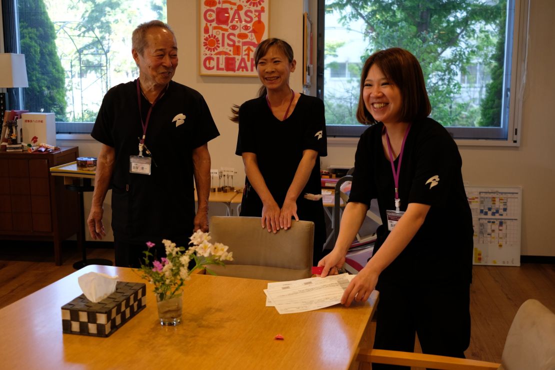 Tasaka Keichi jokes with his younger colleagues.