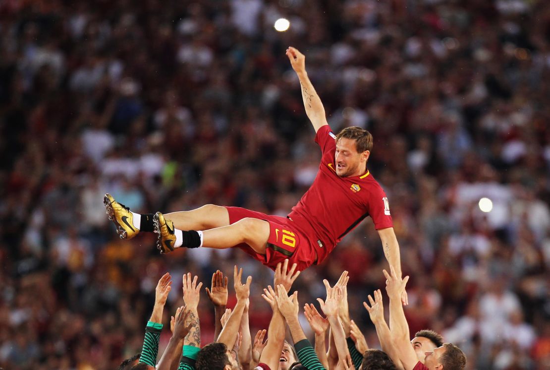 AS Roma players hold up Francesco Totti after his last match for the club.