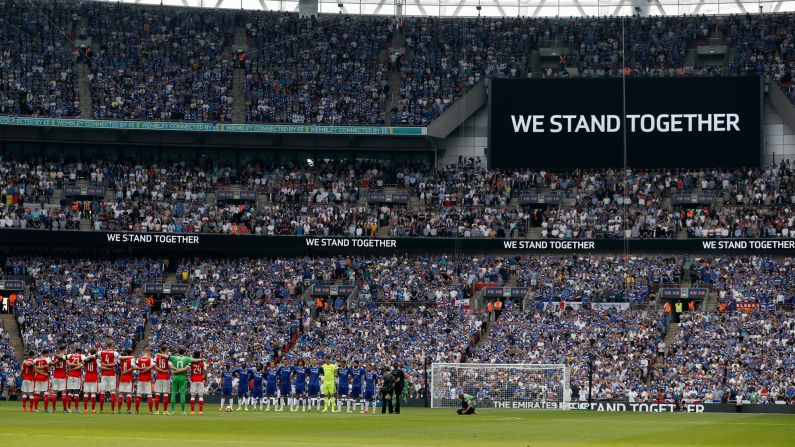 Soccer players from Arsenal and Chelsea pause for a minute's silence before the FA Cup final in London on Saturday, May 27. They were paying tribute to victims of <a href="index.php?page=&url=http%3A%2F%2Fwww.cnn.com%2F2017%2F05%2F22%2Feurope%2Fgallery%2Fmanchester-arena-incident%2Findex.html" target="_blank">the recent bomb attack</a> in Manchester, England.