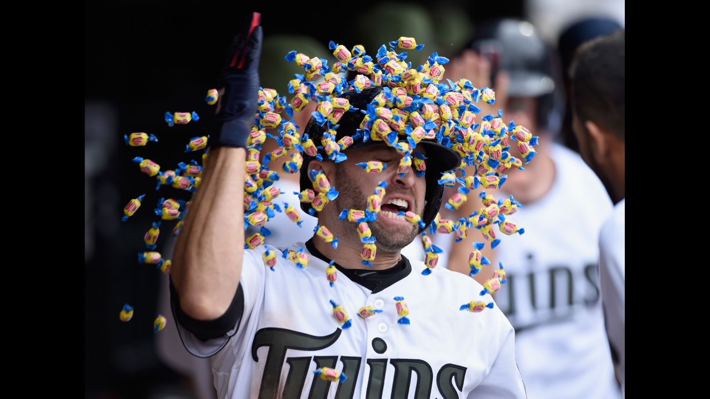 Minnesota's Brian Dozier gets a bubble-gum shower from a teammate after hitting a home run against Tampa Bay on Saturday, May 27. The two-run blast in the eighth inning lifted the Twins to a 5-3 victory.