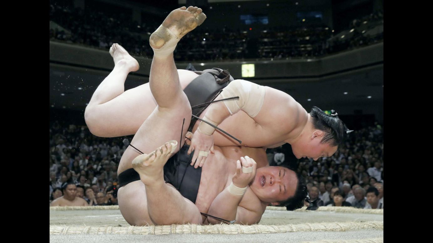 Grand champion Hakuho, top, defeats Goeido at a sumo tournament in Tokyo on Wednesday, May 24.