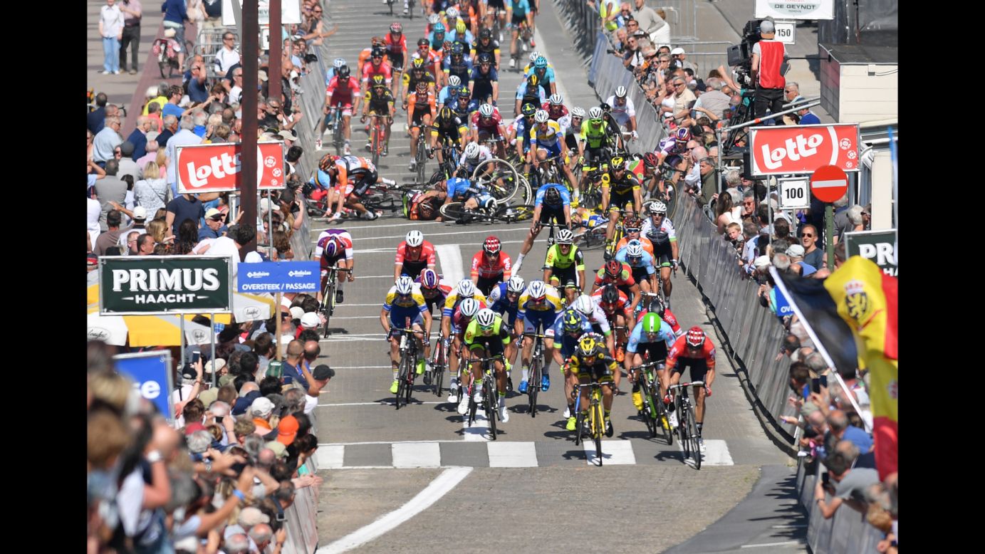 Cyclists crash Wednesday, May 24, during the first stage of the Tour of Belgium.
