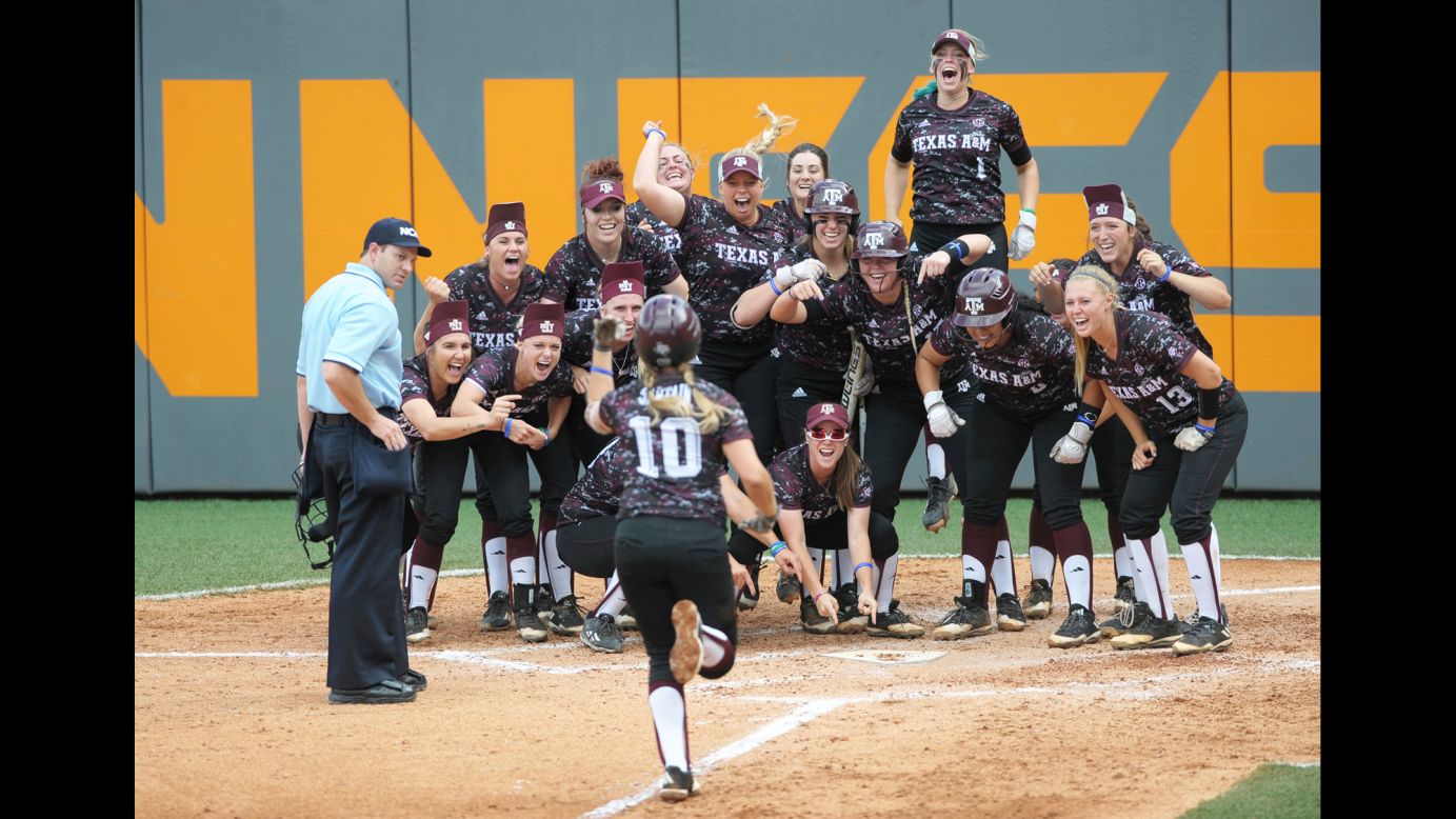 Teammates wait on Texas A&M's Riley Sartain after she hit a home run against Tennessee in their NCAA softball game on Sunday, May 28. Texas A&M won the game to advance to the College World Series.