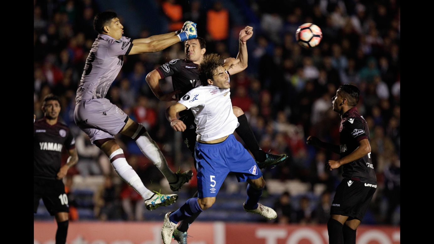 Lanus goalkeeper Esteban Andrada punches the ball away during a Copa Libertadores match in Montevideo, Uruguay, on Tuesday, May 23.