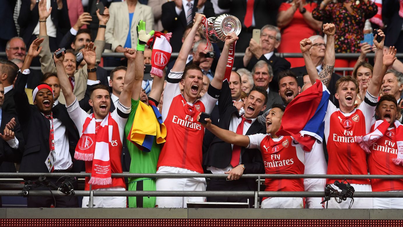 Arsenal defender Per Mertesacker lifts the FA Cup after a 2-1 victory over Chelsea on Saturday, May 27. Arsenal has won England's premier cup competition a record 13 times.